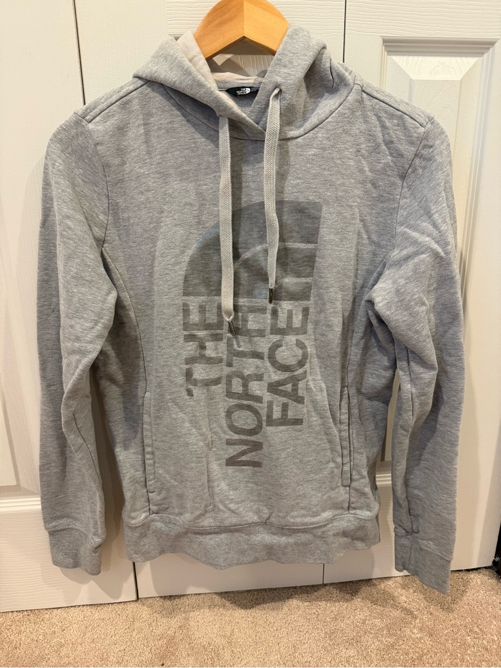 The North Face Woman’s Light Gray Pullover Hoodie with Vertical Logo